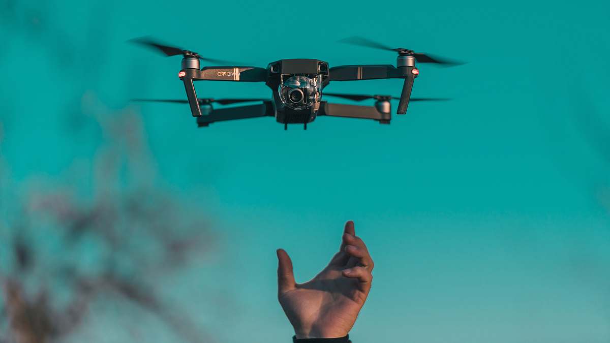 flying tilt shift lens photo of mini drone camera