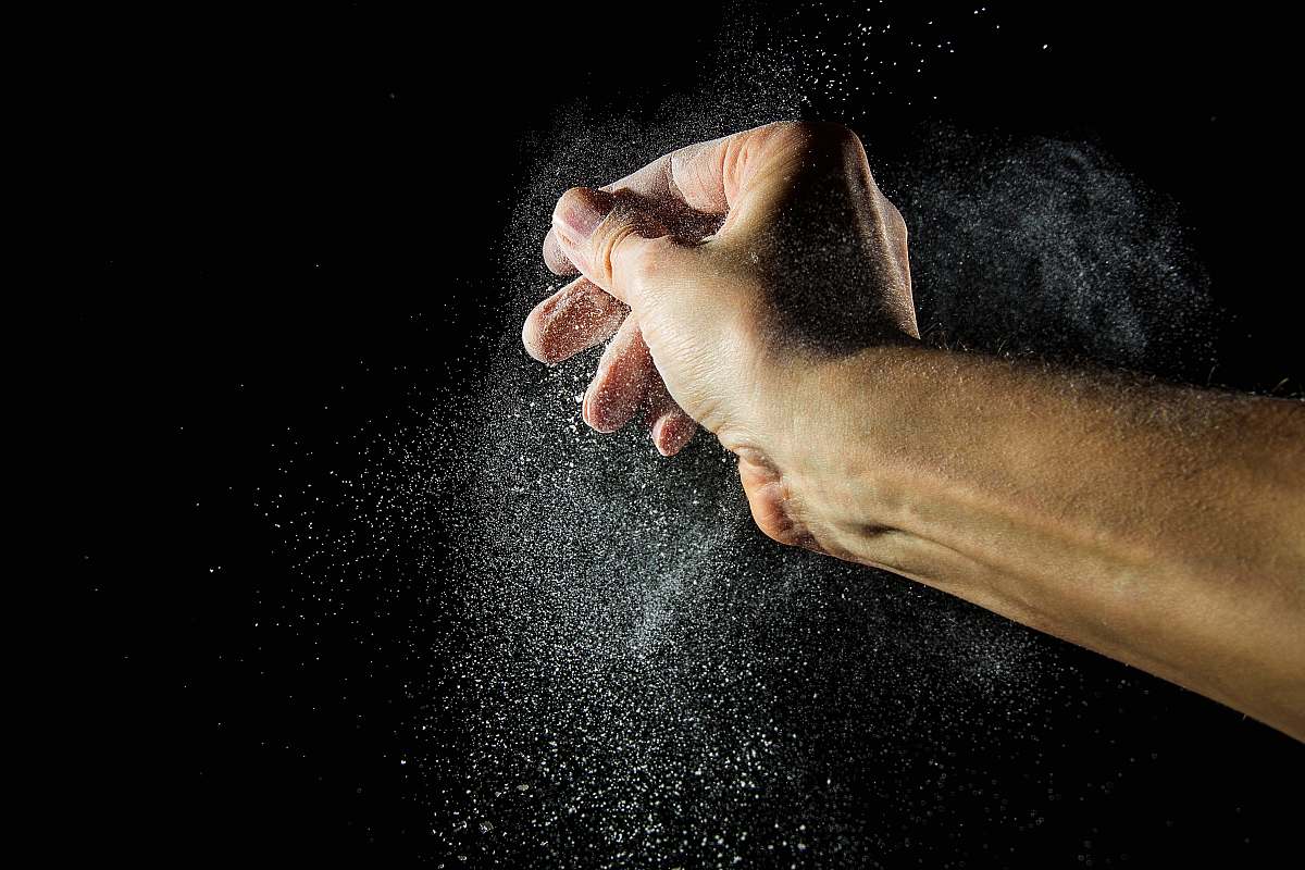 animal time lapse photography of person's hand with powder pet