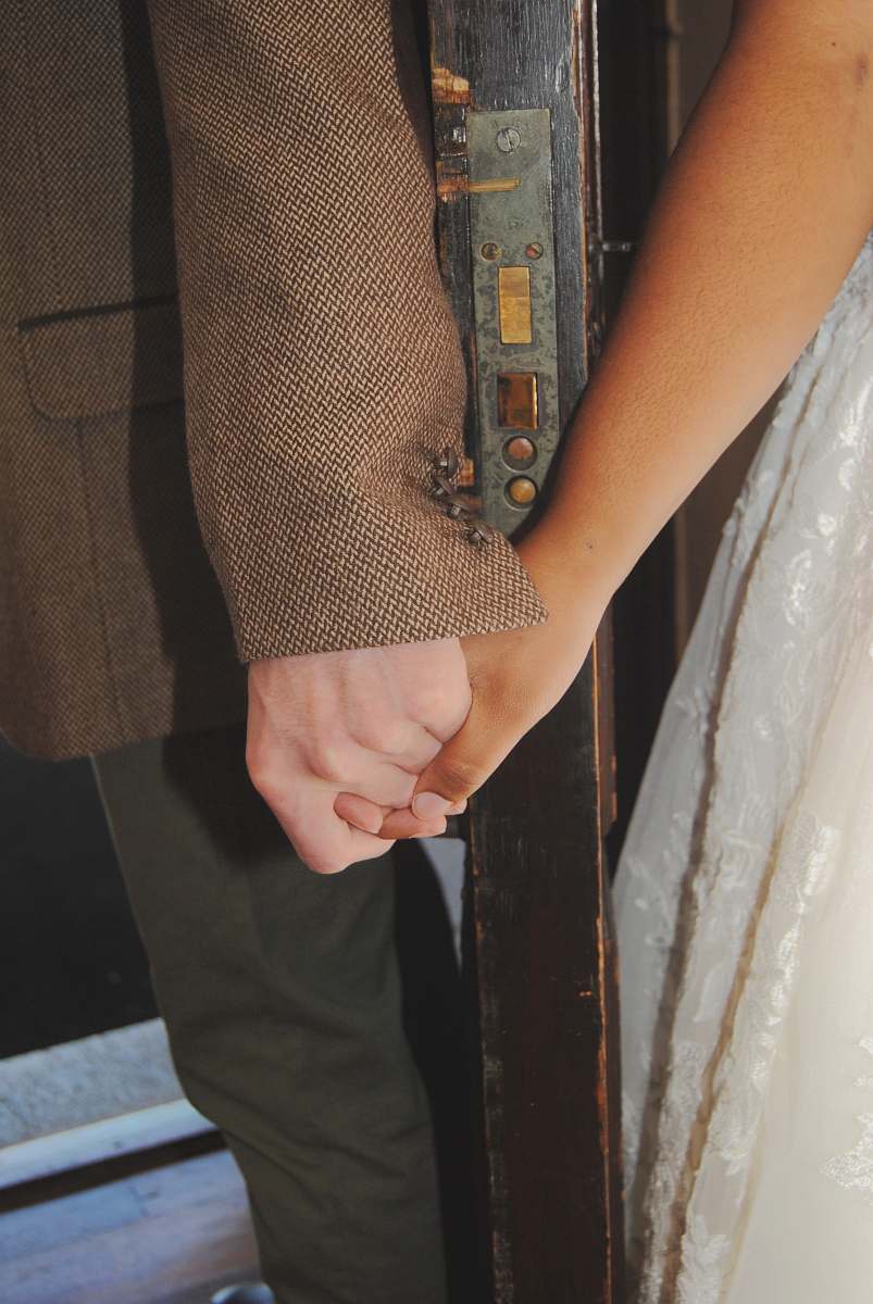 apparel two person holding hands holding hands