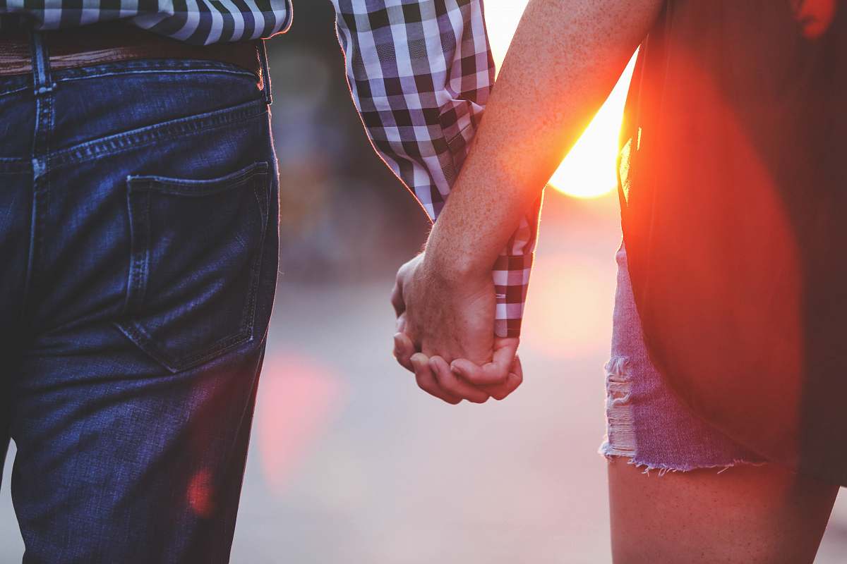 human two person standing and holding hands together holding hands