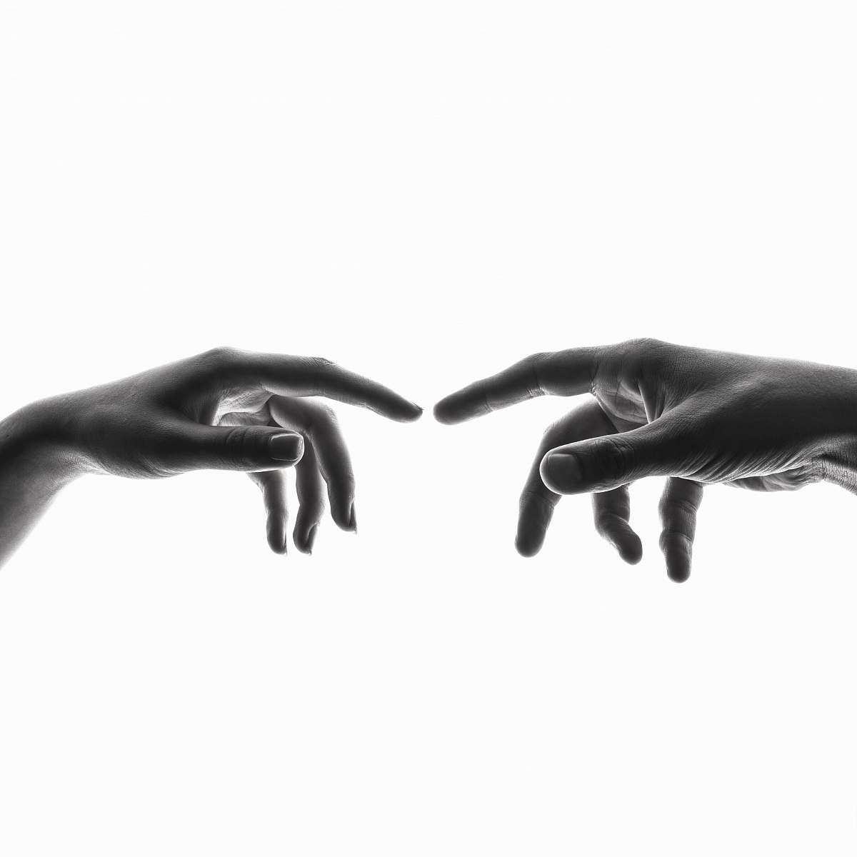 person two person's connecting fingers black-and-white