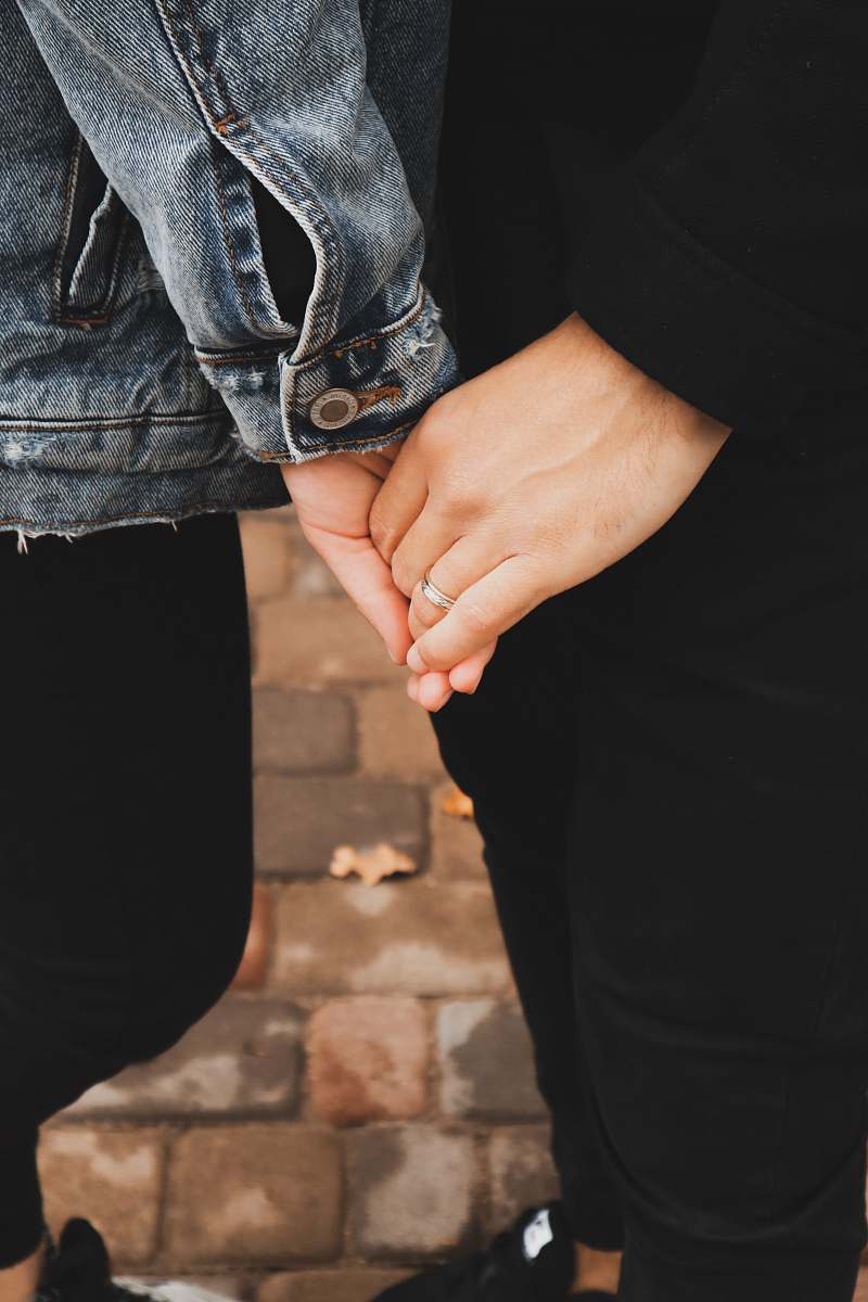 human two persons holding each other hands holding hands