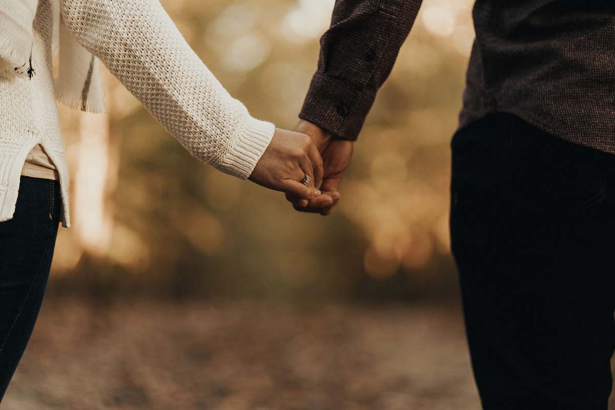 human woman and man holding hands holding hands
