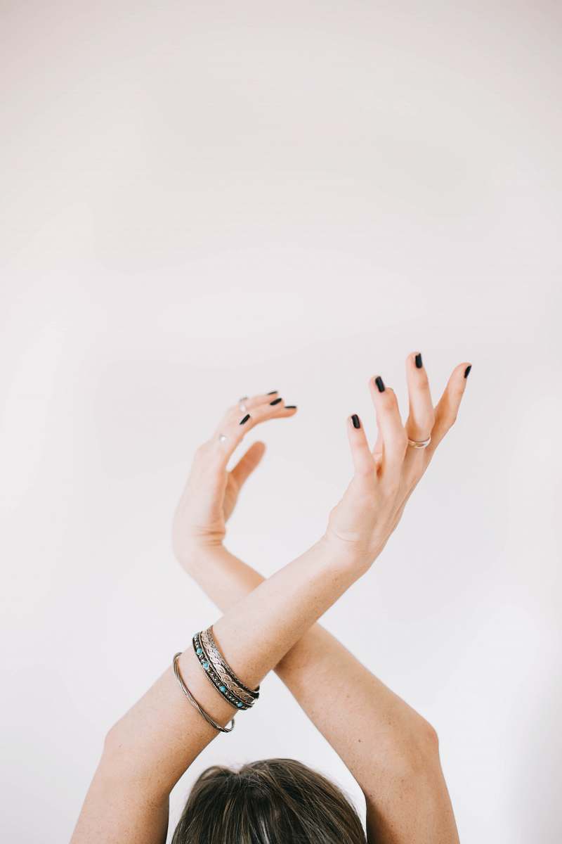 people woman raising her both hands hands