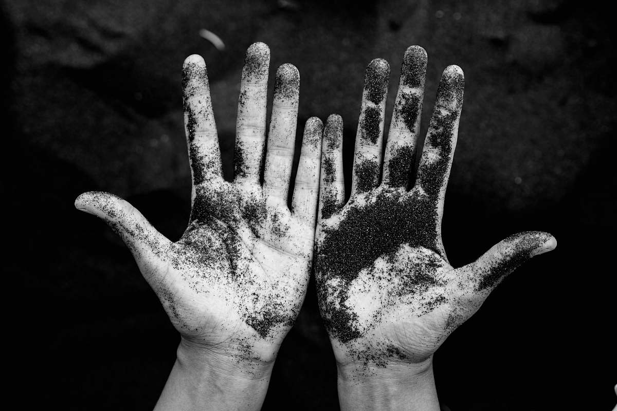 black-and-white grayscale photo of person's hands la palma