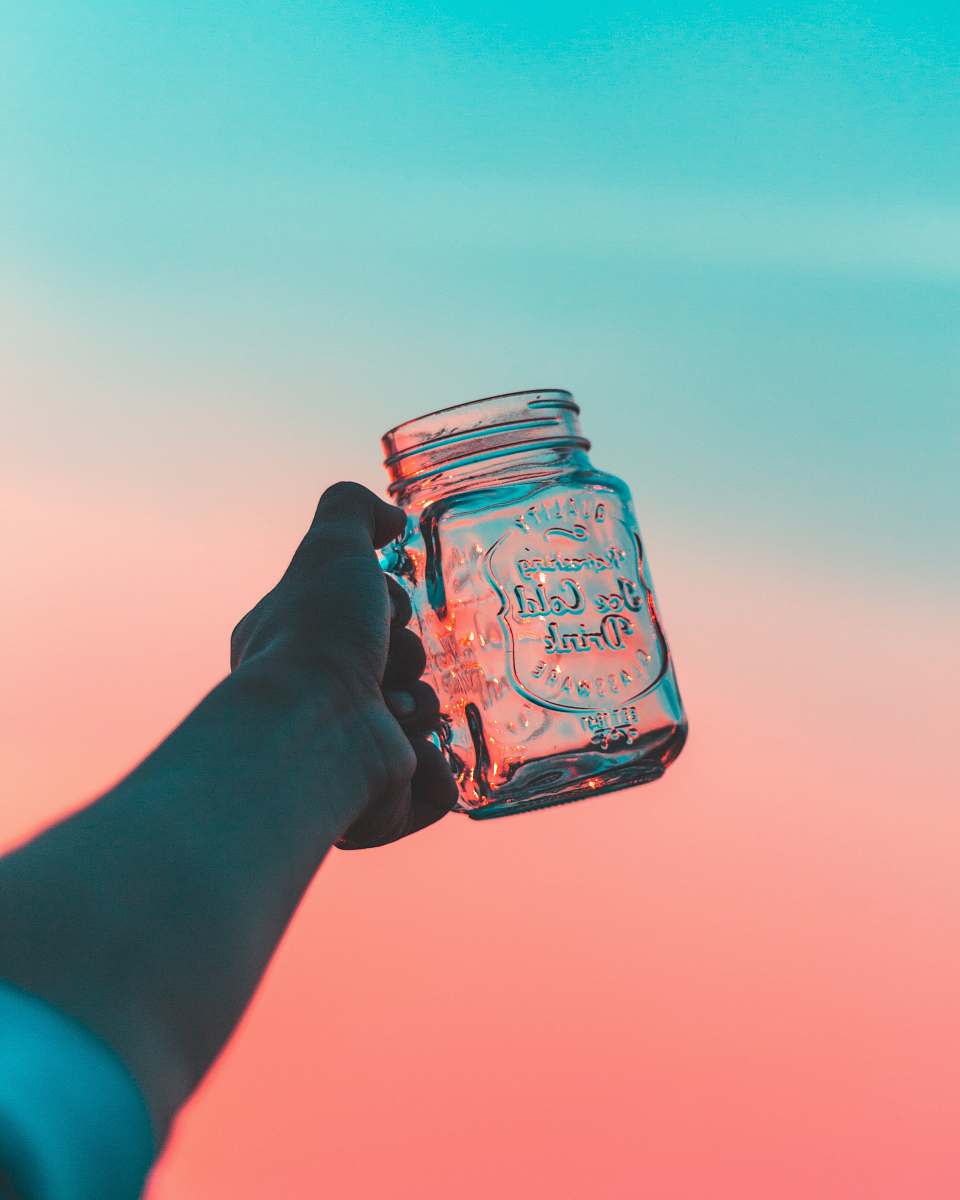 pastel closeup photo of person's holding jar jar