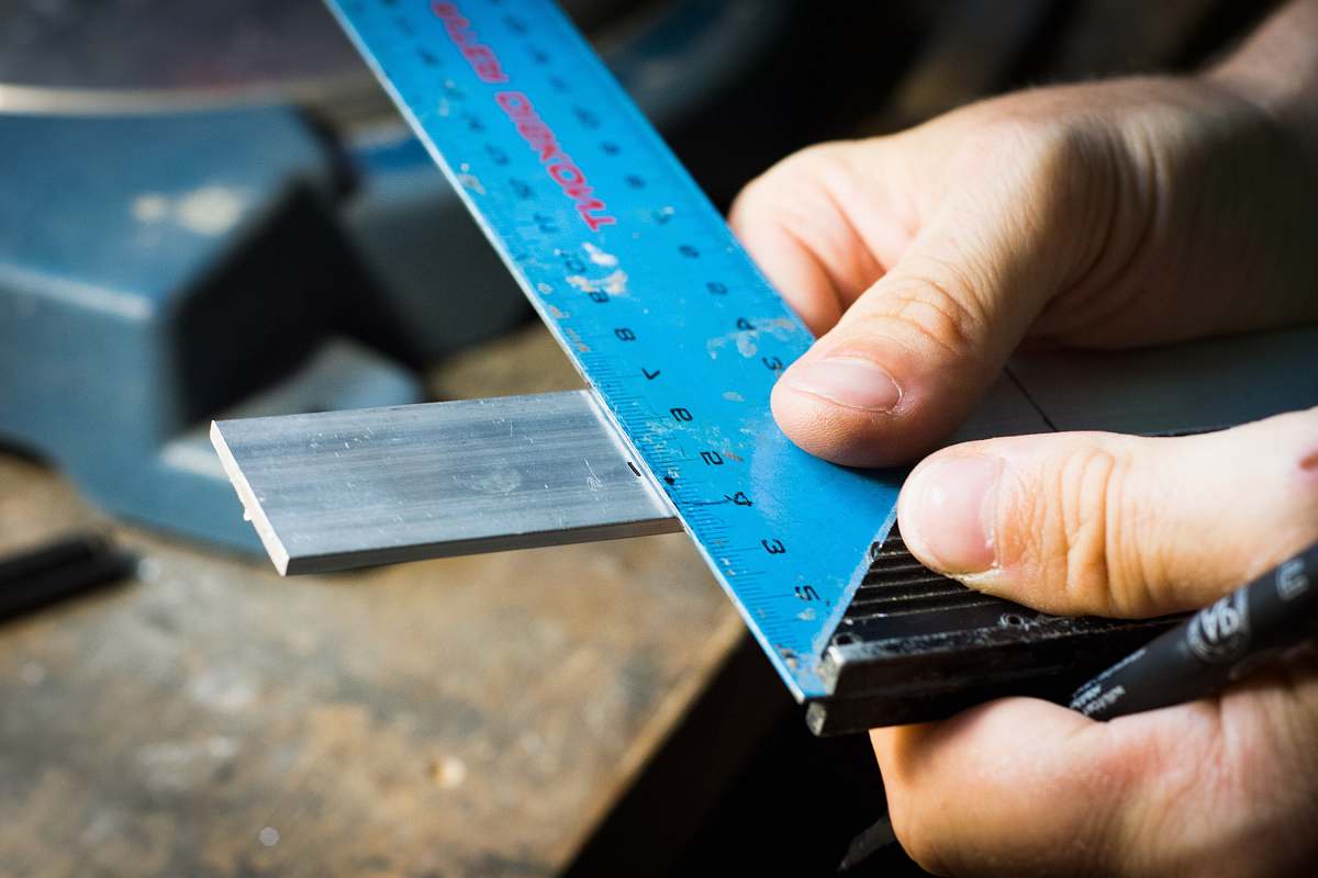 person blue ruler hand