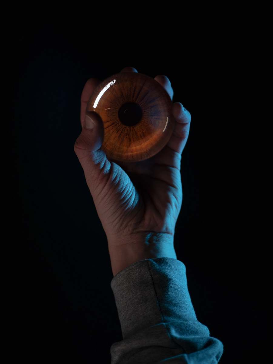 person brown artificial eye finger