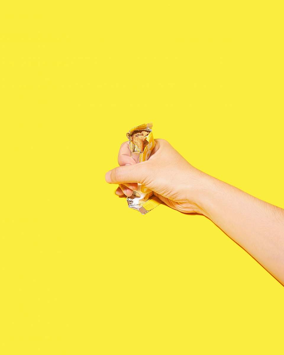 person candy bar in hand