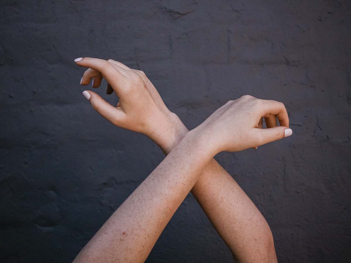 person crossed person's arms hand