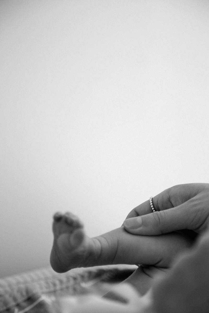 person grayscale photo of baby black-and-white