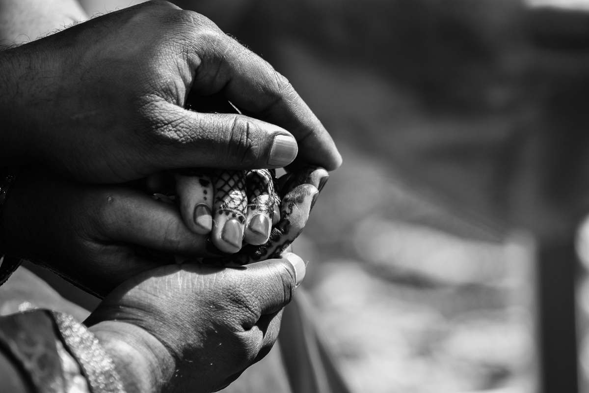 person grayscale photography of human hands black-and-white