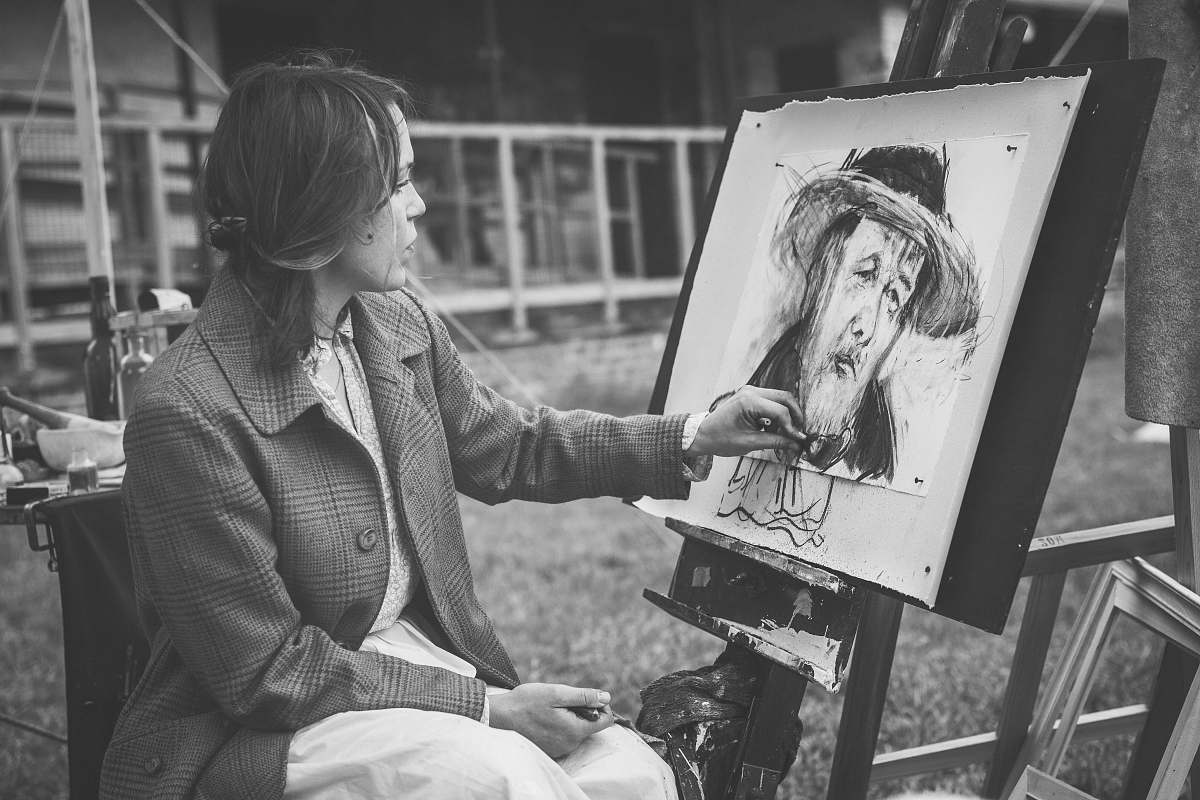 grey grayscale photography of woman sitting while painting black-and-white