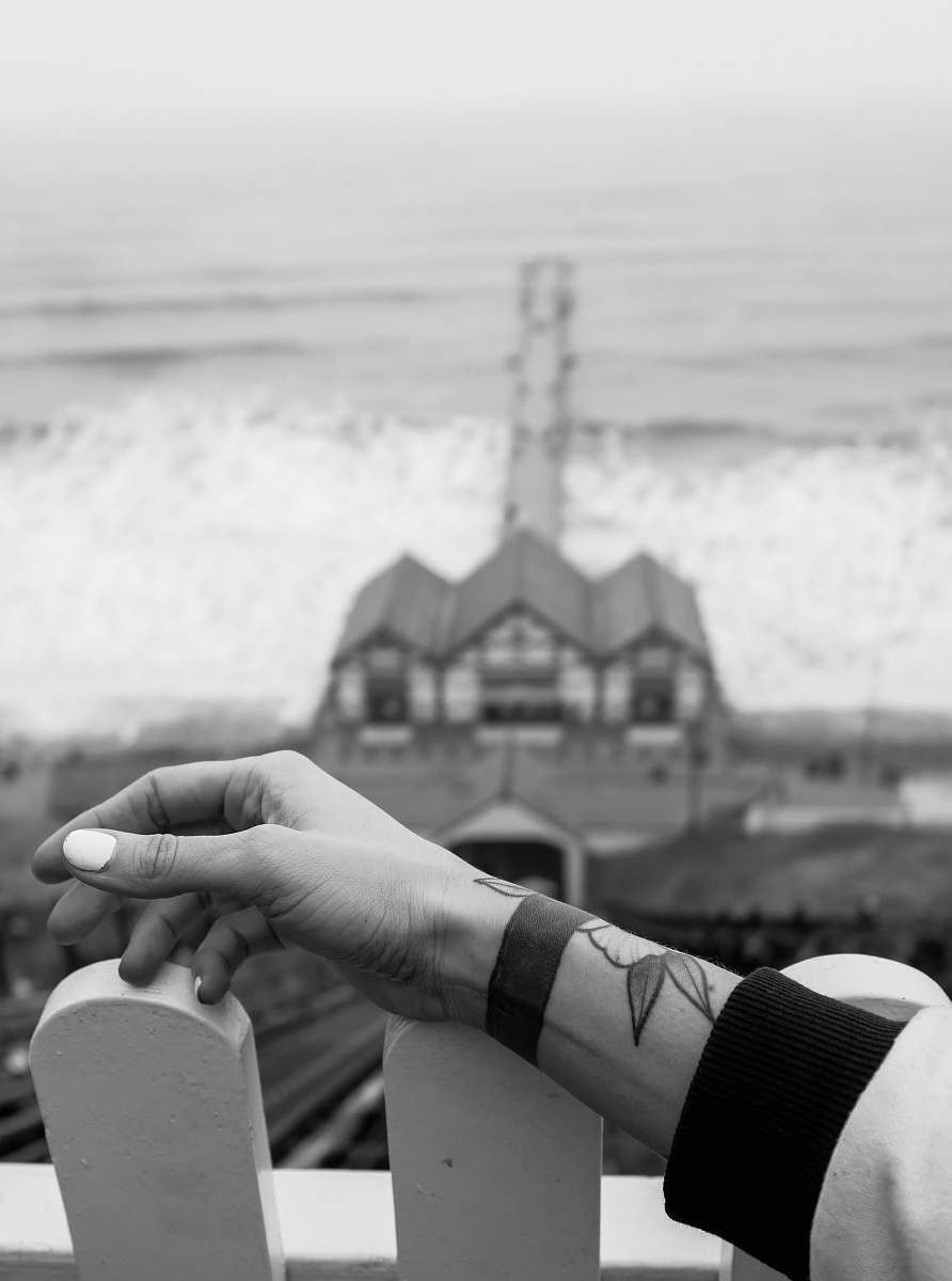 black-and-white house beside body of water during day skin