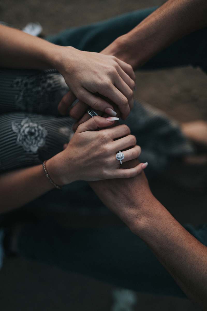 person man and woman holding each others hands people