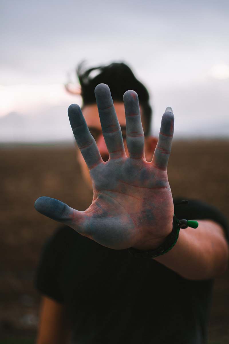 person man wearing black t-shirt during daytime finger