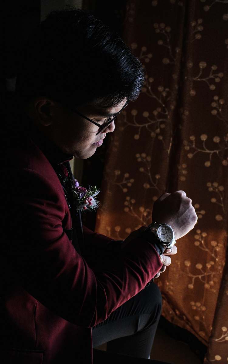person man wearing red blazer hand