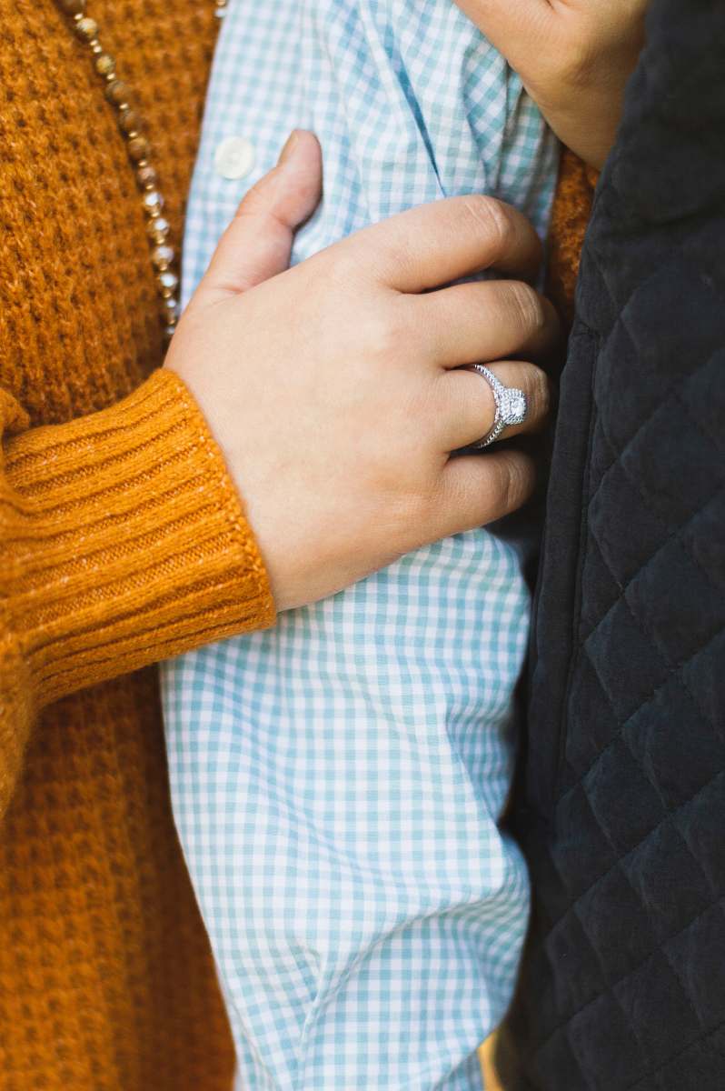 finger person holding another person's arm person