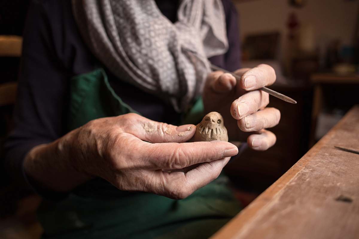 person person holding bird wood craft people