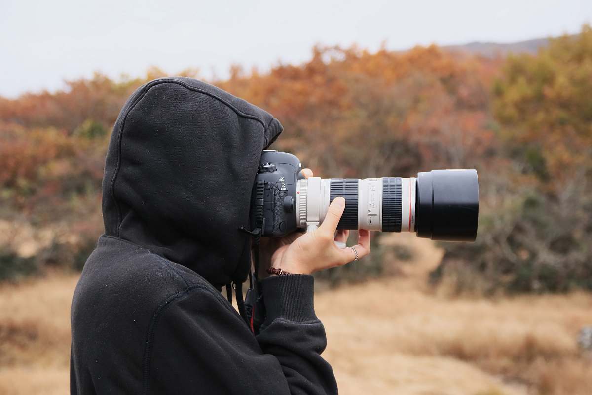 person person holding camera people