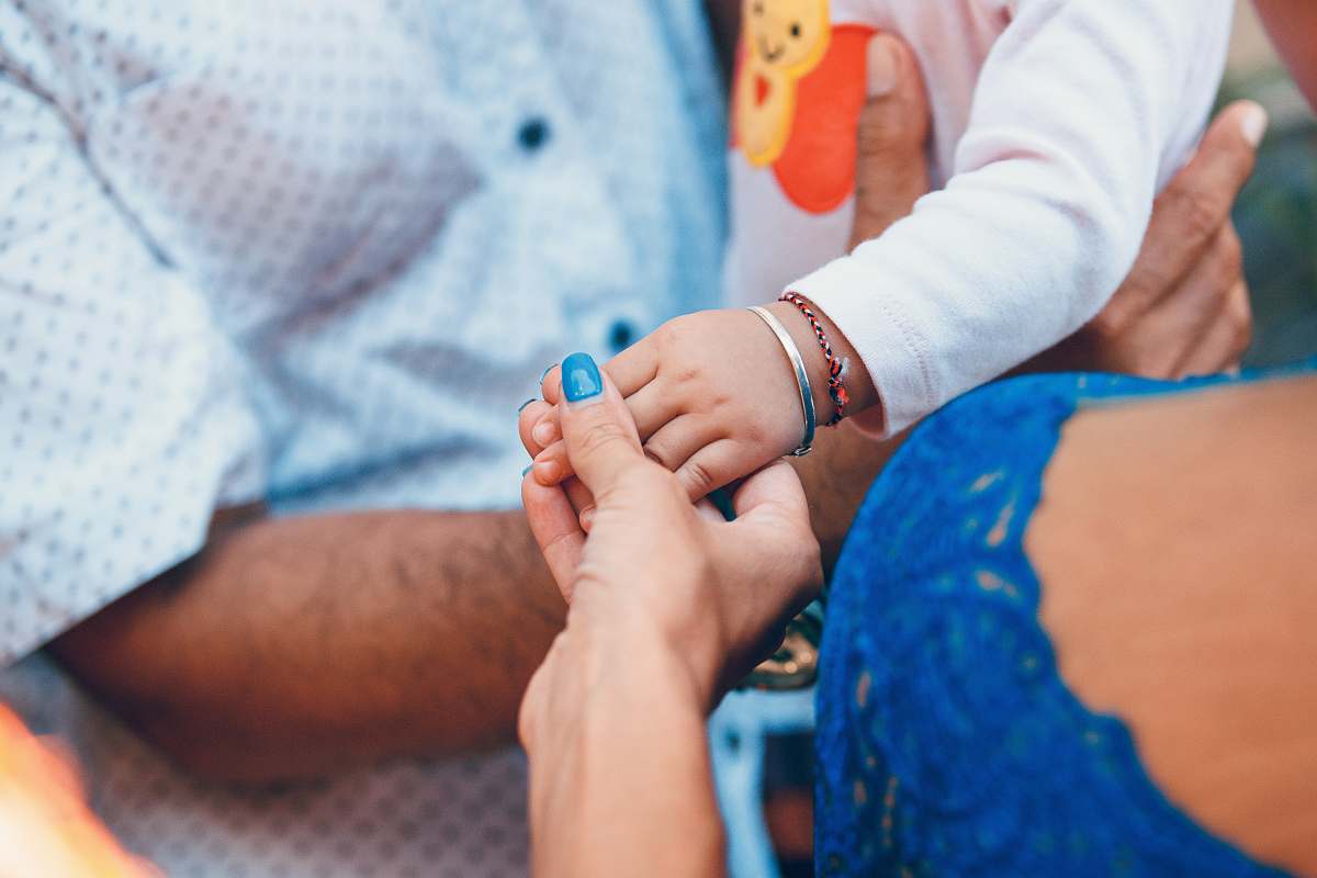 person person holding child hand people