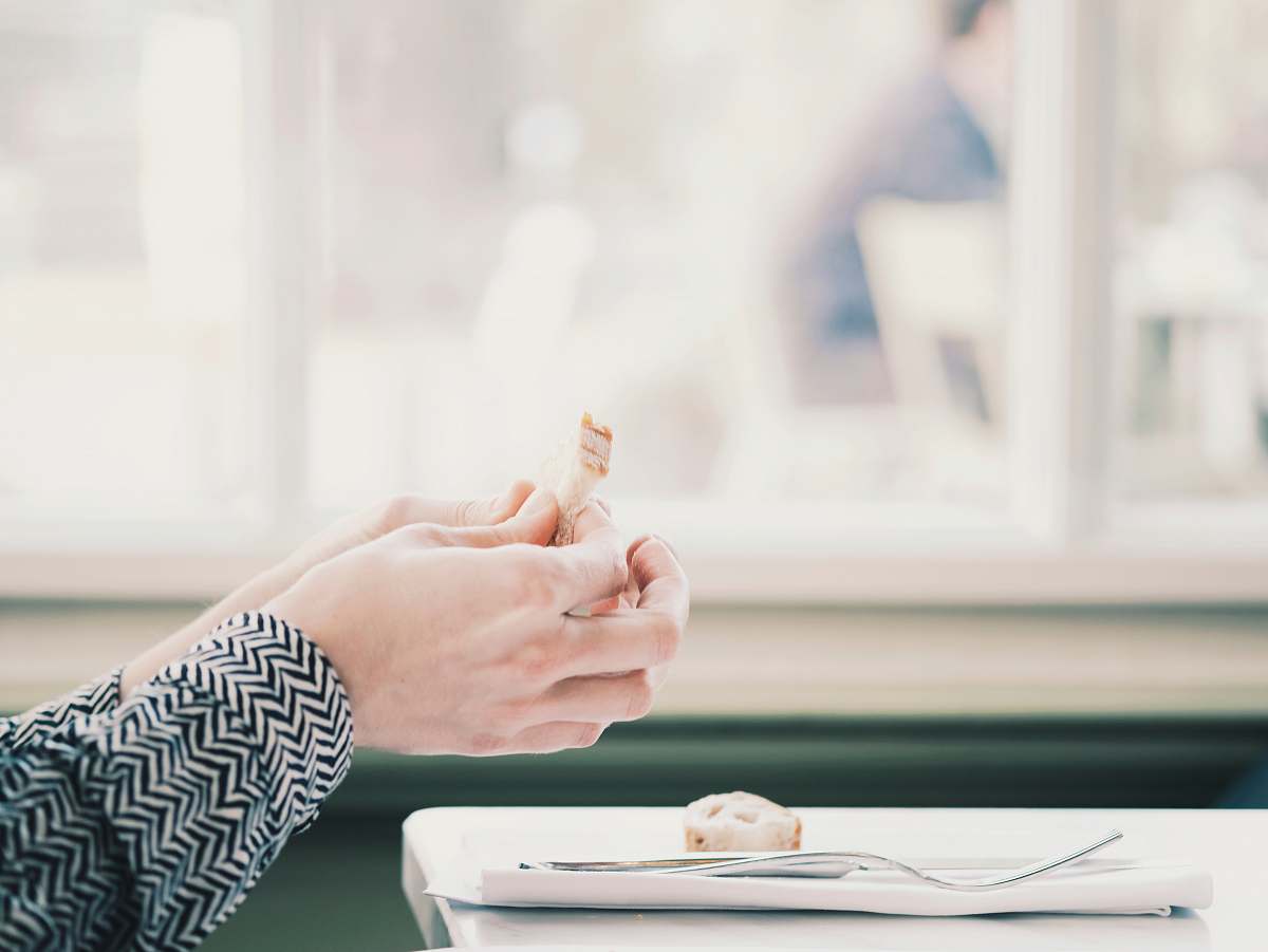 person person holding food hand