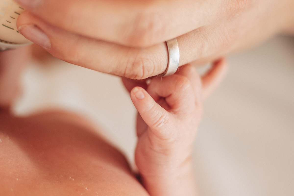 person person holding hand with baby han hand