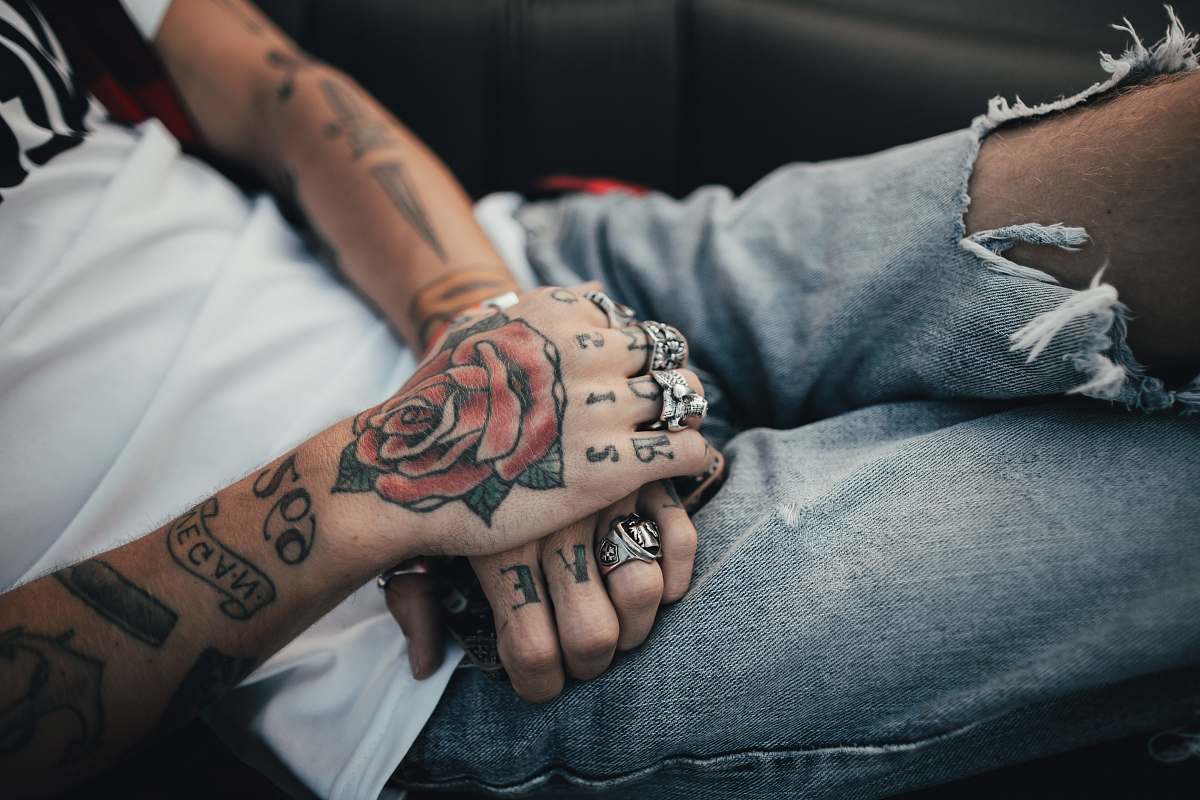skin person holding man's hand tattoo
