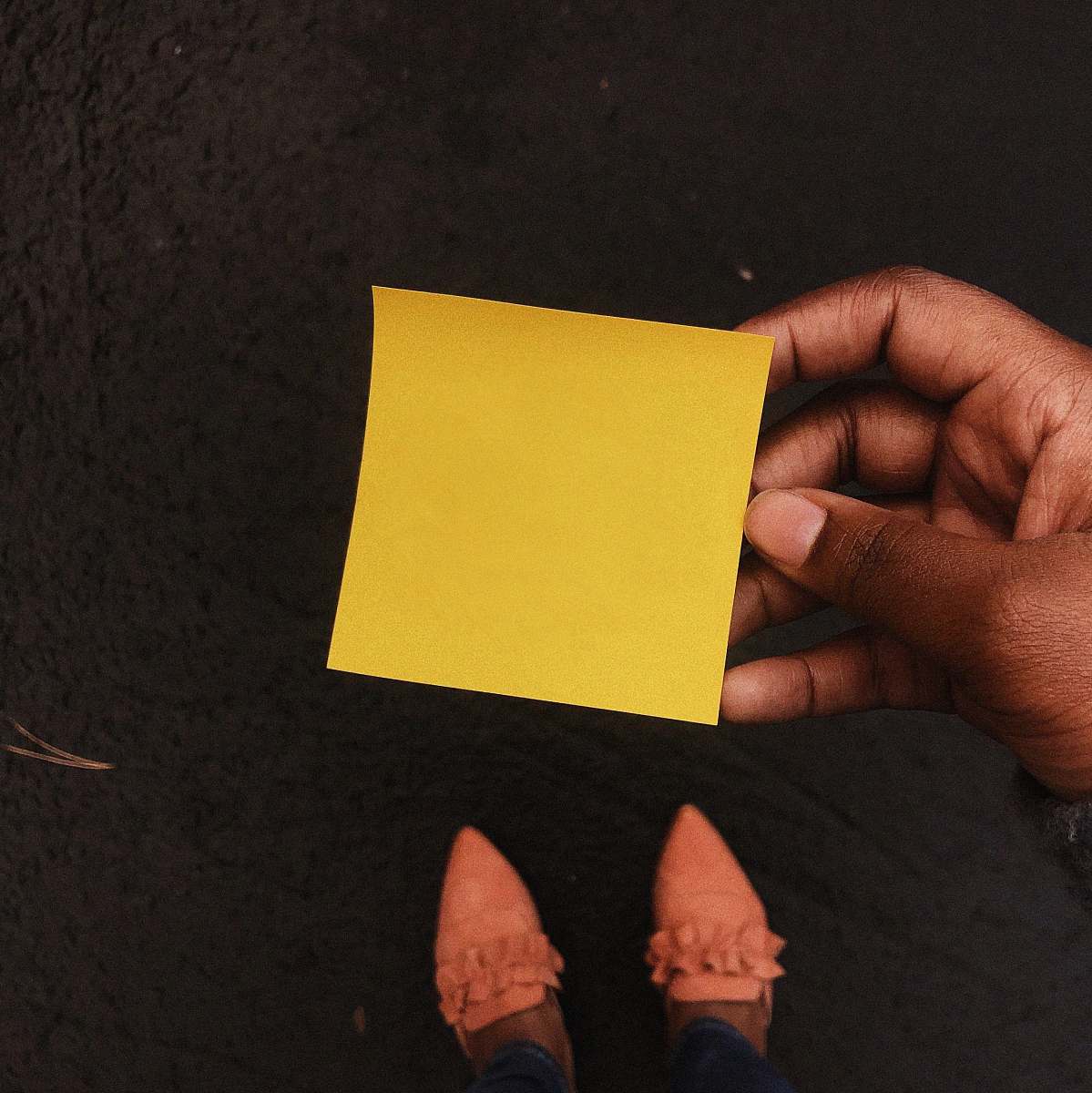 person person holding note paper