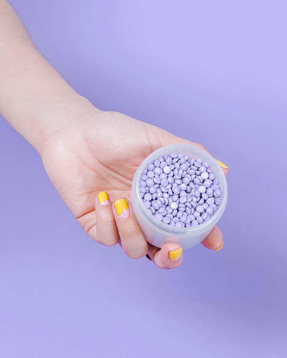 person person holding plastic jar hand