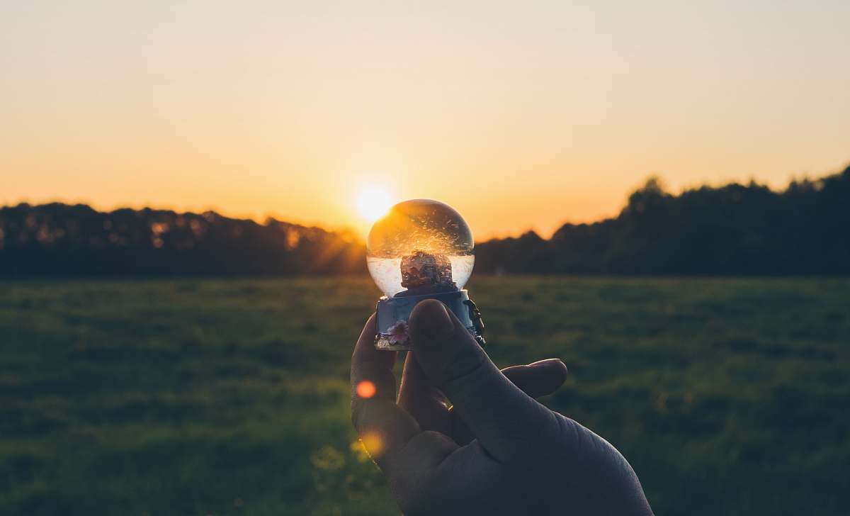 flare person holding water globe light