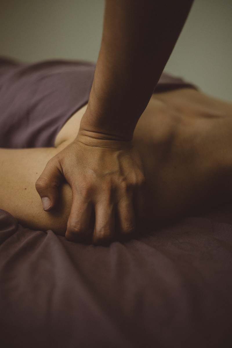 person person pushing hand on person's shoulder finger