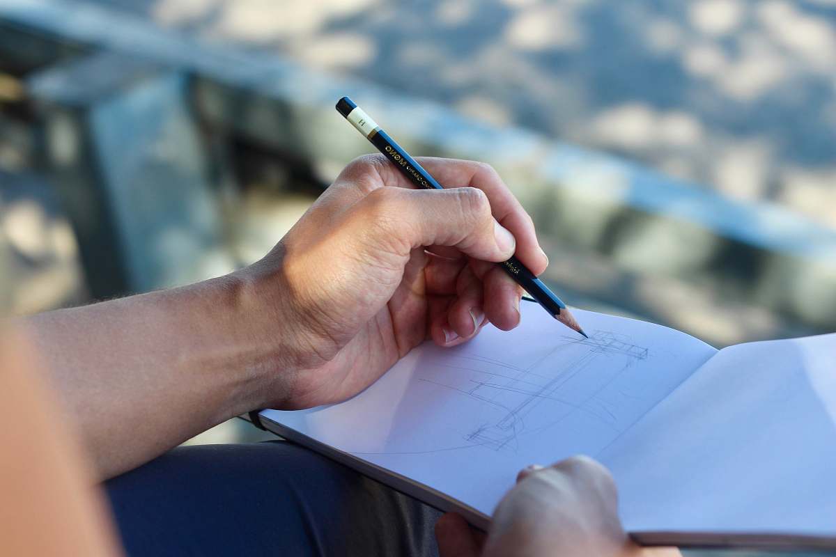 person person sketching on white pad people