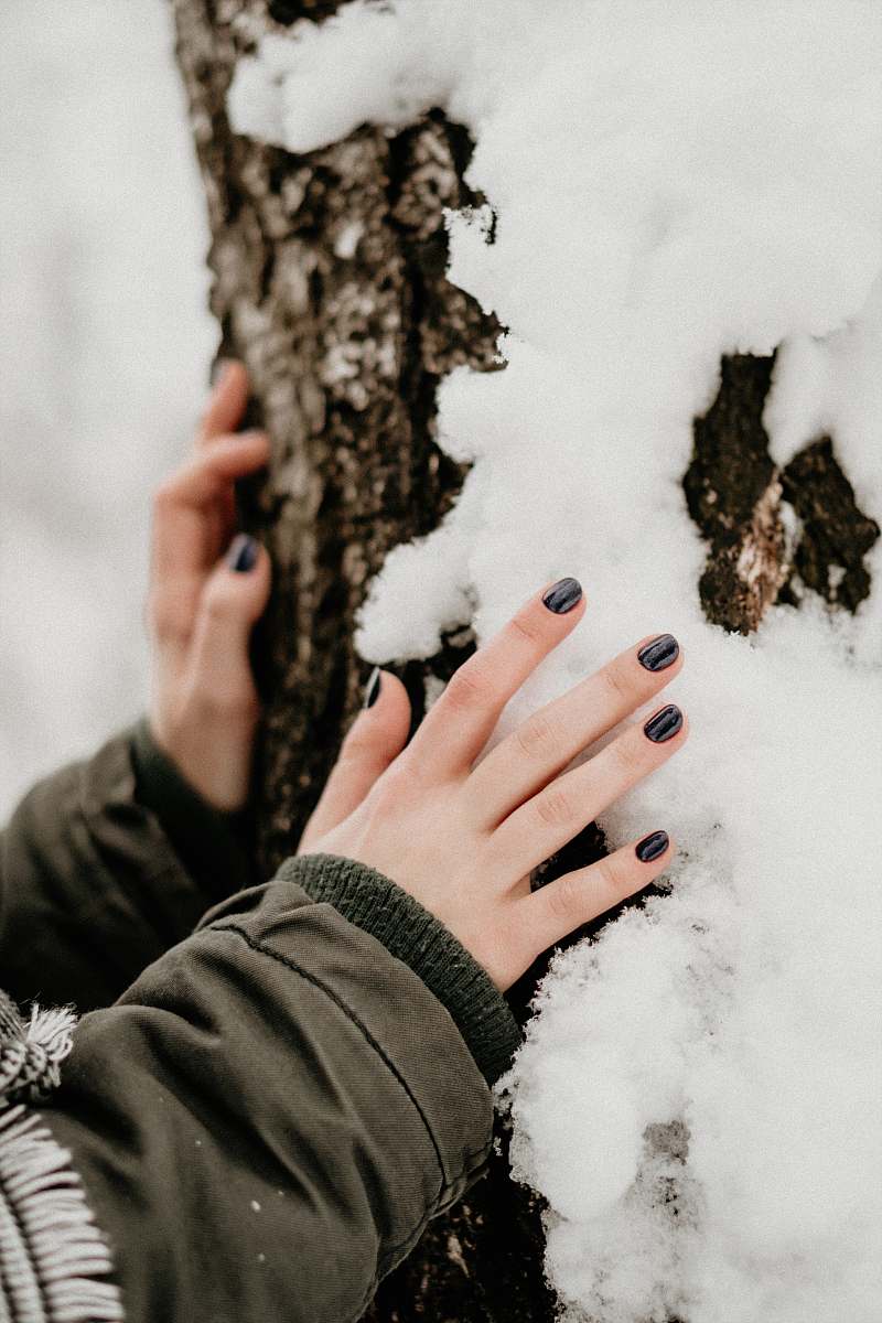 person person touching gray stone finger