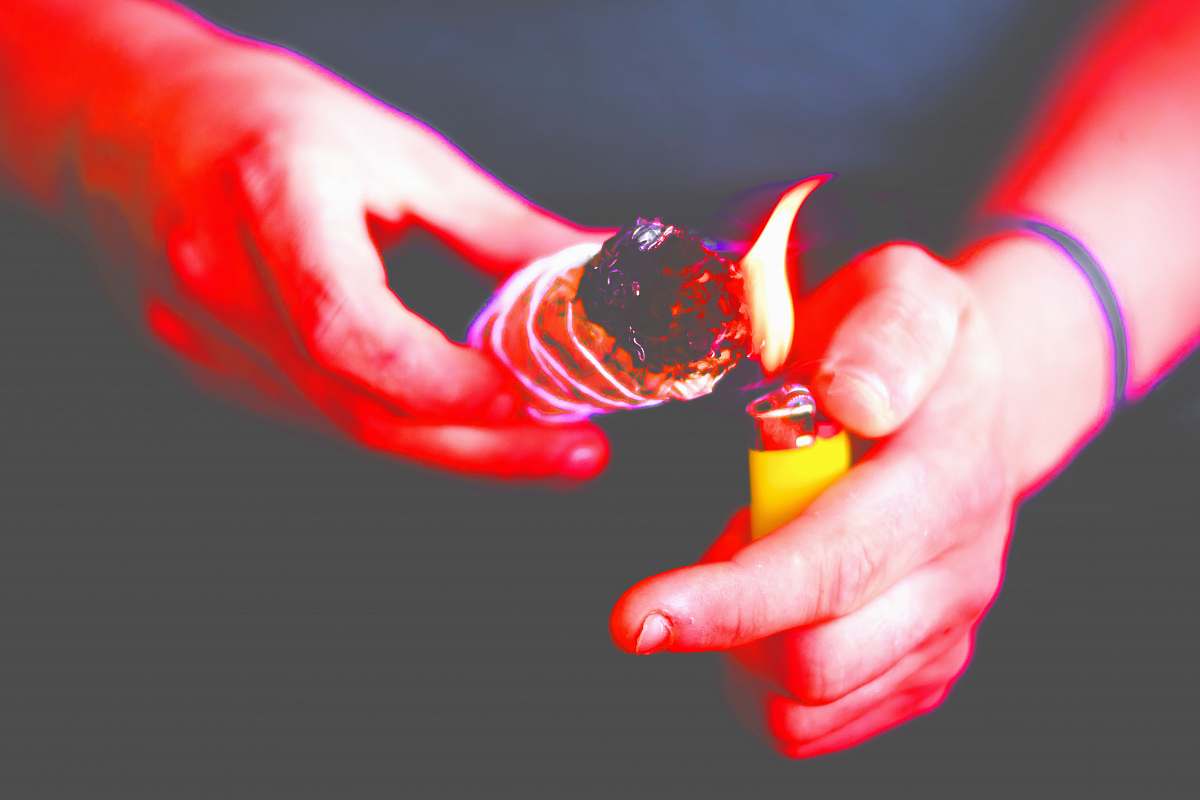 hand person using disposable lighter flame