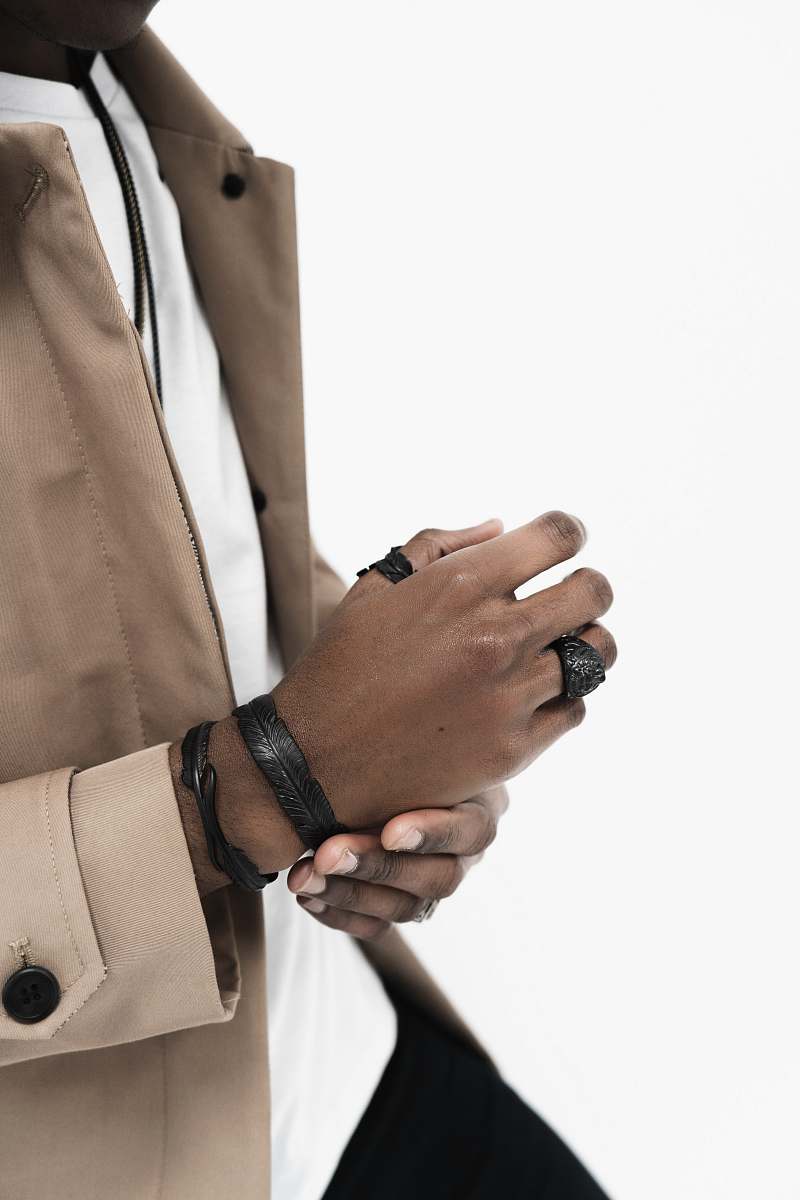 hand person wearing brown jacket finger