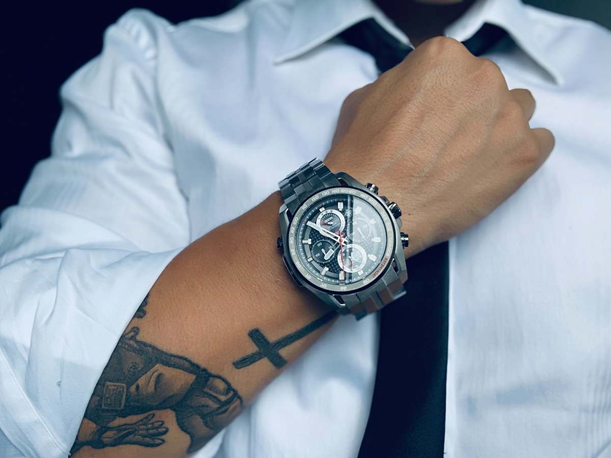 person person wearing gray analog and digital watch wristwatch