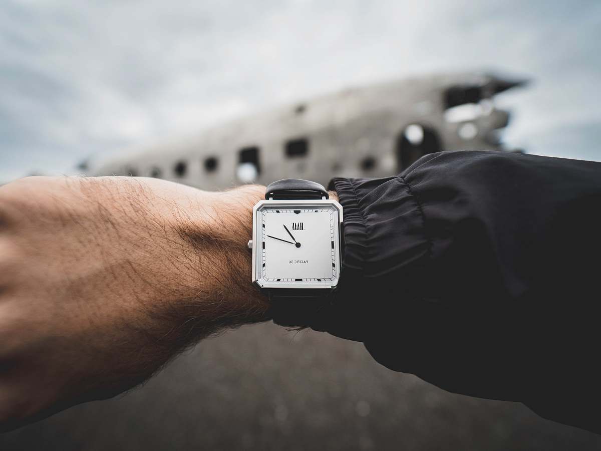 wristwatch person wearing silver-colored analog watch person