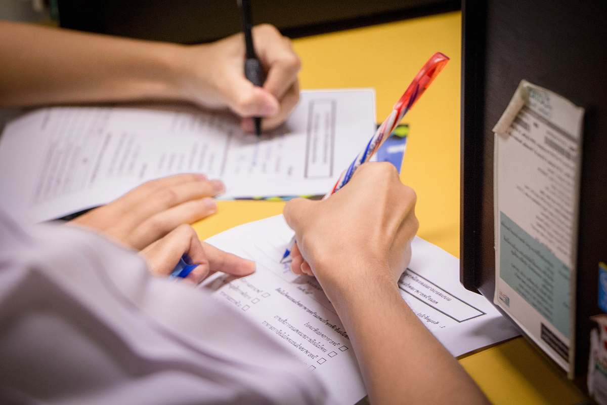 person person writing on white paper text