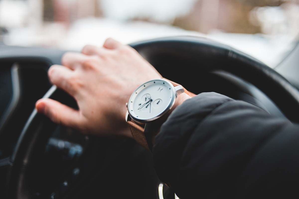 person round silver-colored analog watch wristwatch
