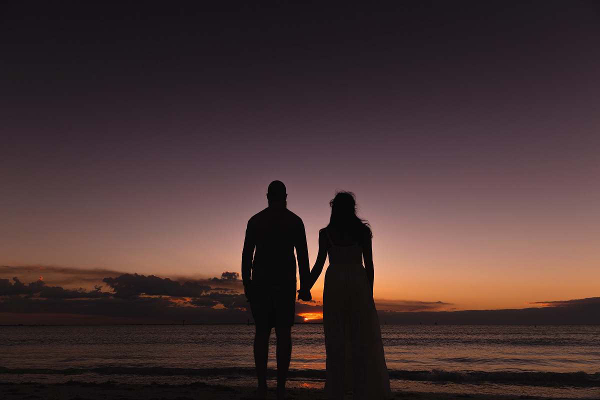 person silhouette of couple hand