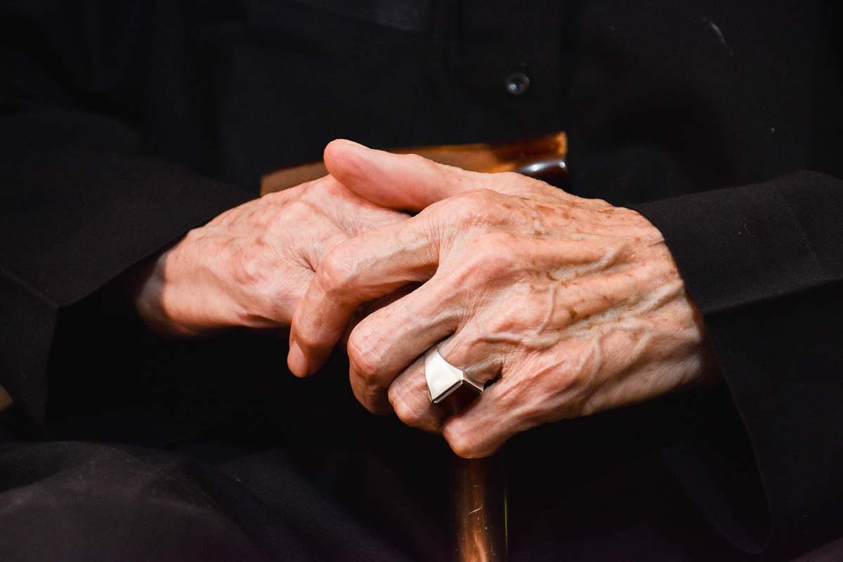 hand silver-colored ring finger