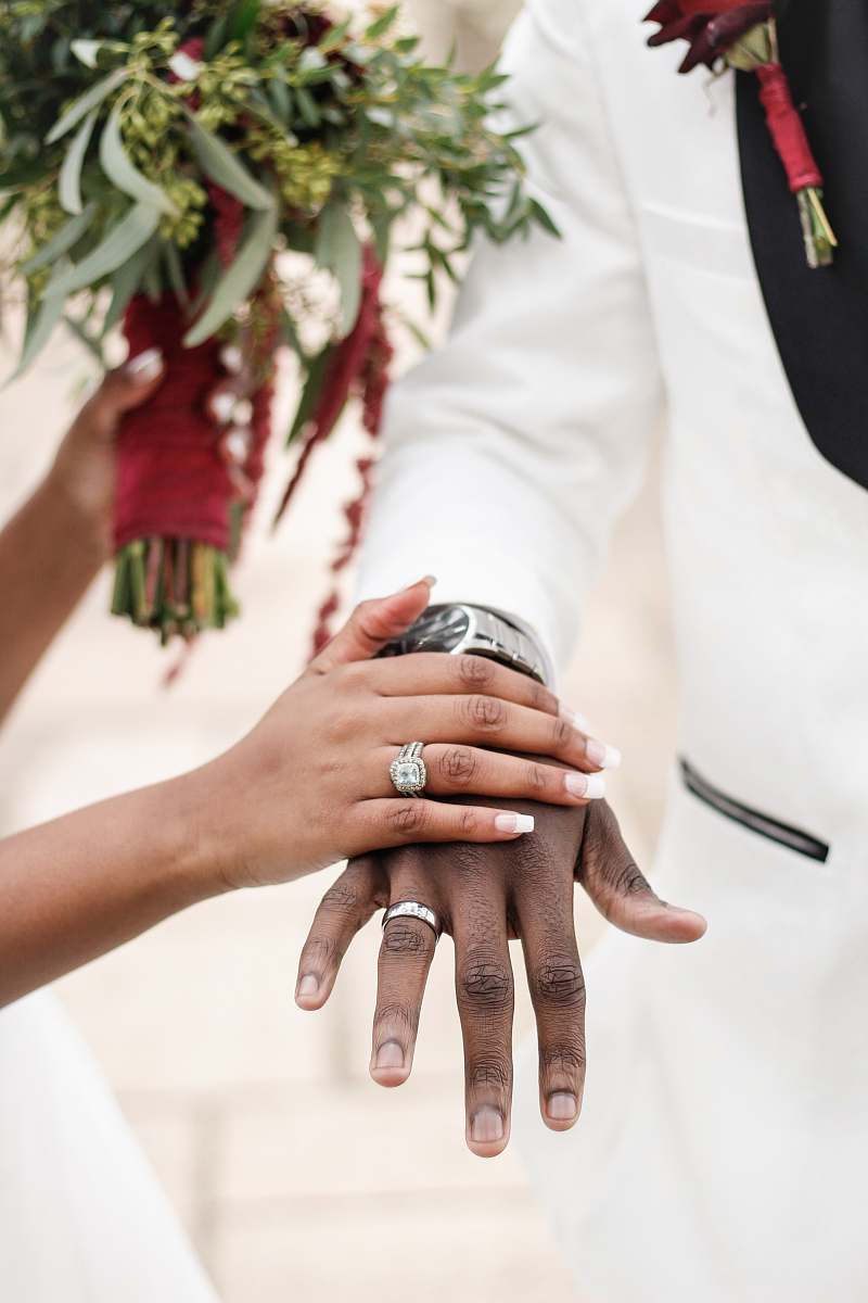 person woman holding the man's hand finger