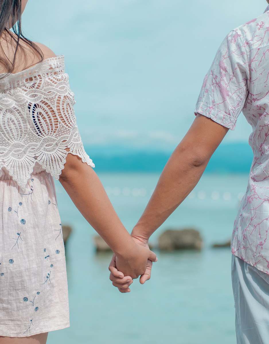 person woman wearing white dress hand