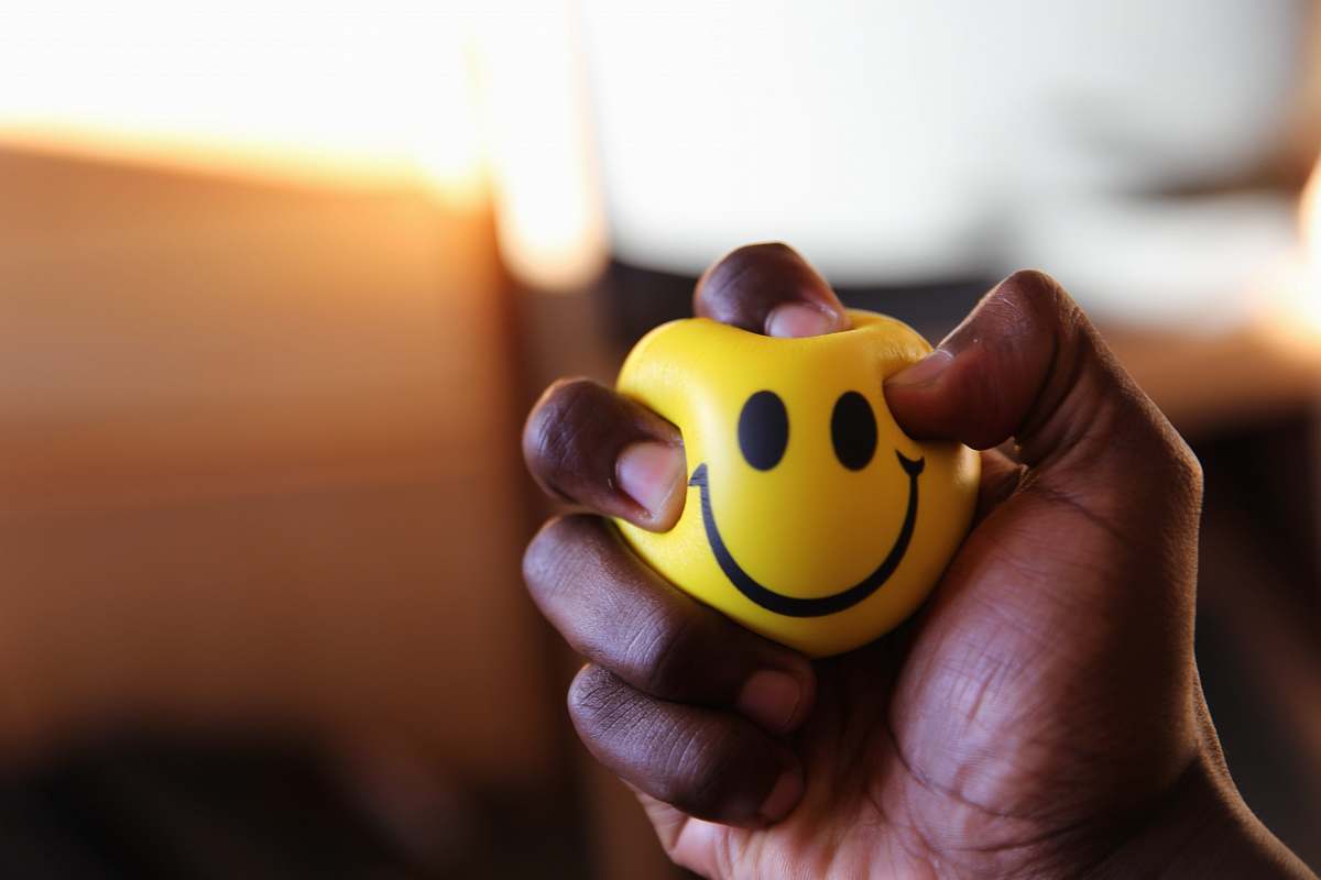 toy yellow emoticon plastic ball finger