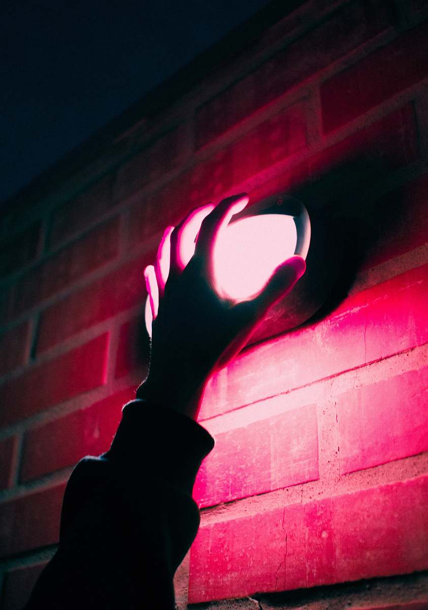 flare person touching red light hand