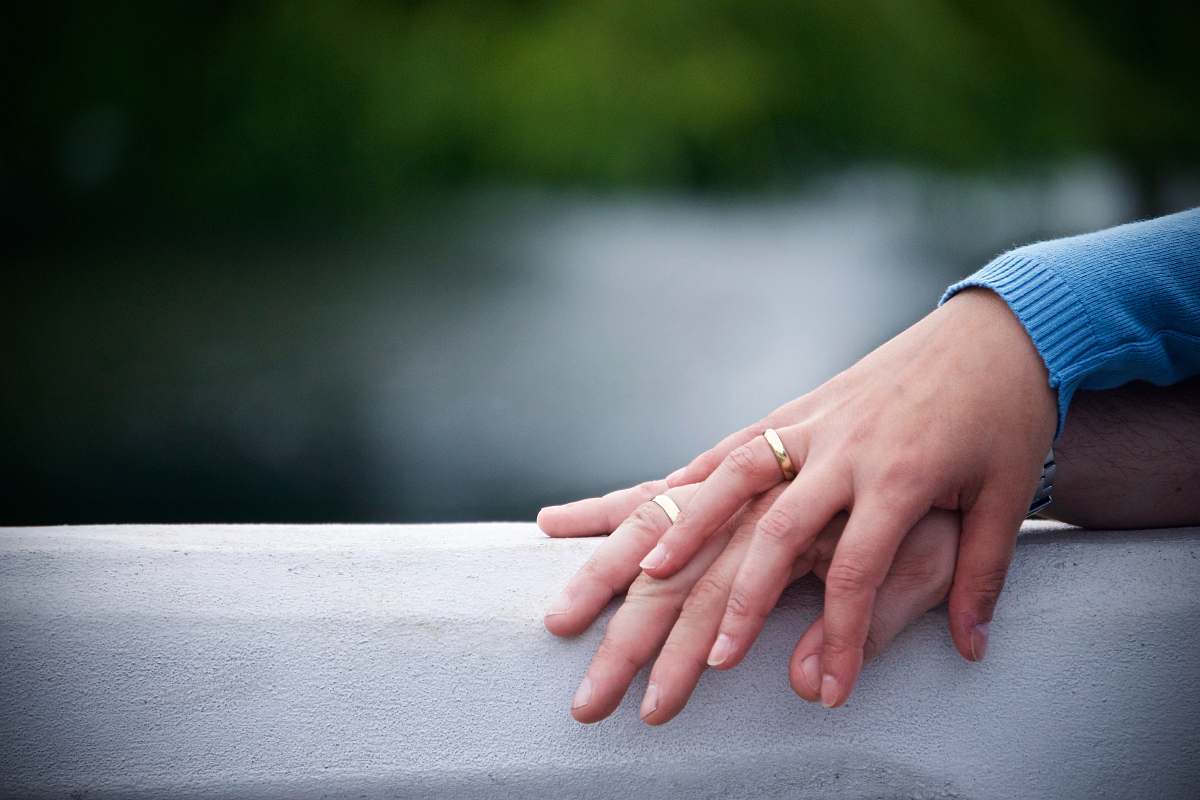wedding two hands on gray surface hand