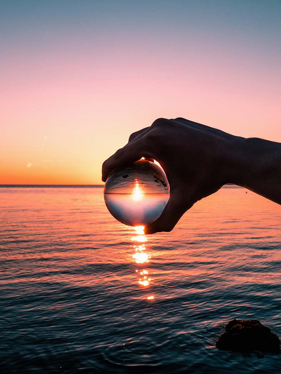 nature crystal ball photography of golden hour sky