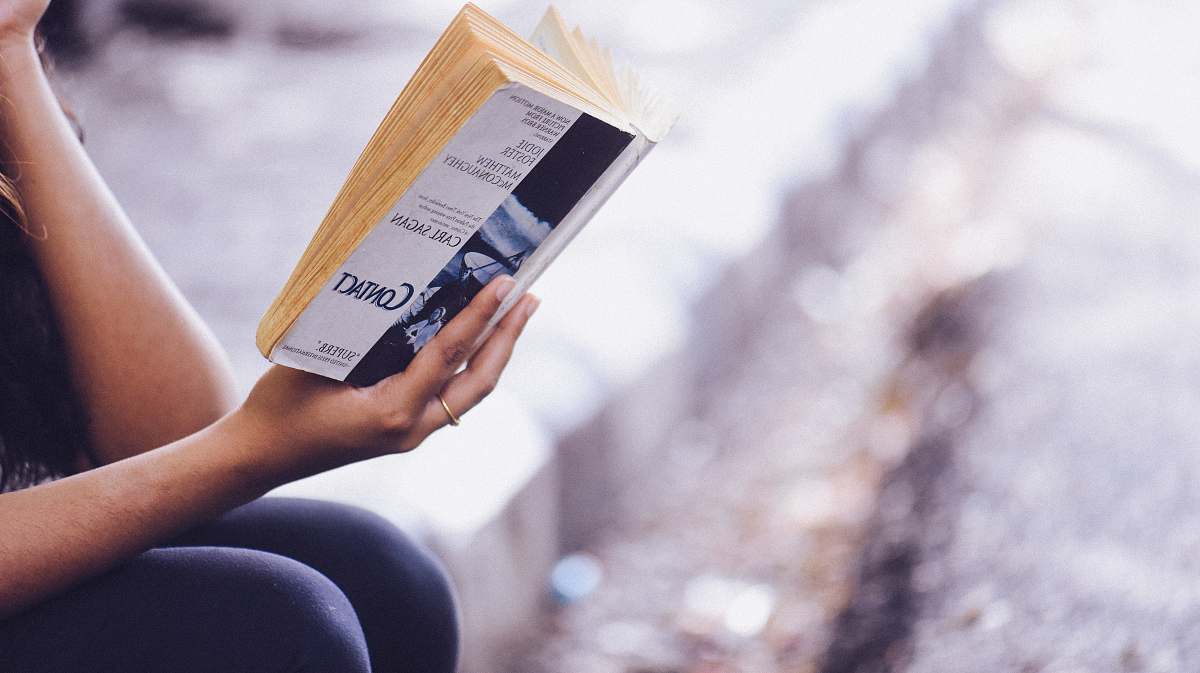 book person holding book reading