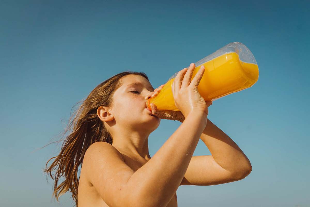 drink girl drinking yellow juice drinking